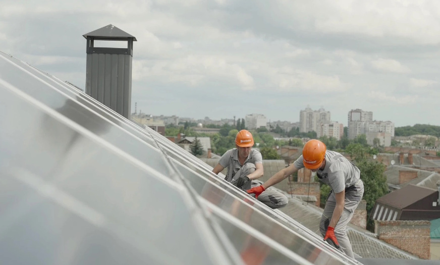 Mounting of the PV panels on the roof of Chernihiv School No. 3, Ukraine.