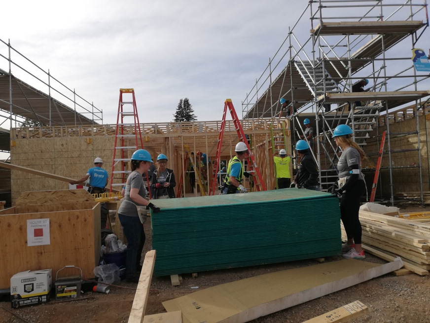 The volunteers who helped with the Carter Work Project are a colorful mix.