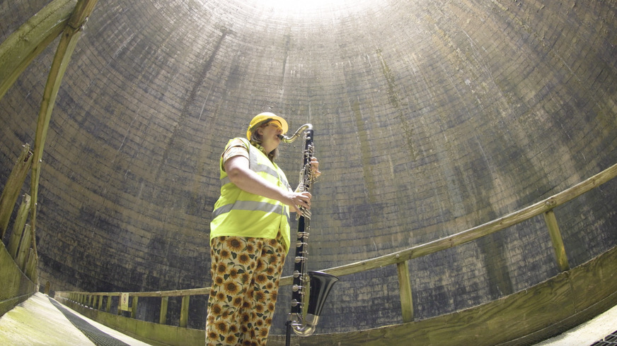 Composer Dr Sarah Watts plays bass clarinet inside a Ratcliffe-on-Soar cooling tower, in a tribute to the station’s workers