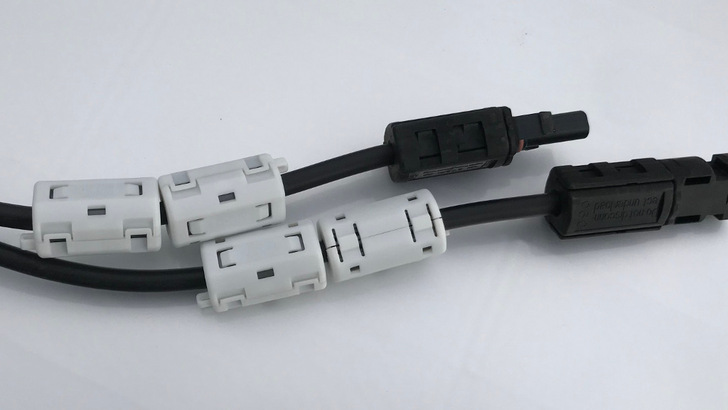 Fitting the DC optimizers with ferrites on each of their wires usually helps to remedy the problem, but is costly and complicated. - © PF
