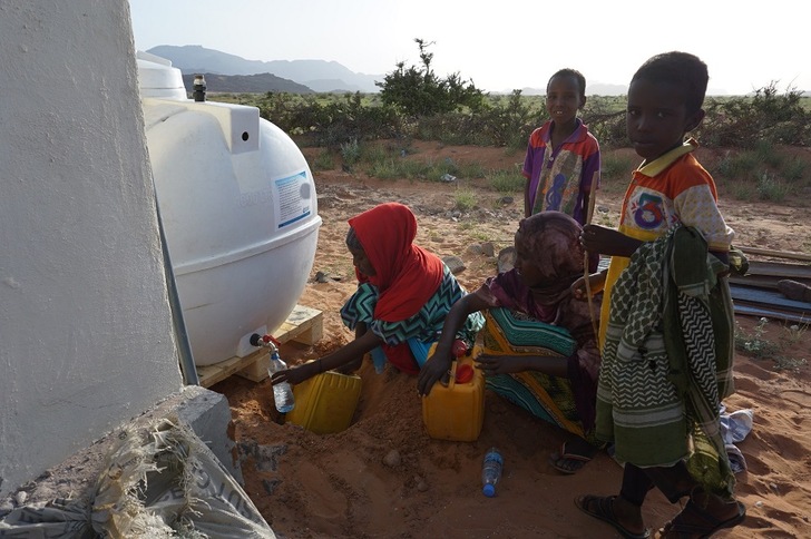 Villagers with the solar-powered water desinlation system in Beyo Gulan, Somaliland.