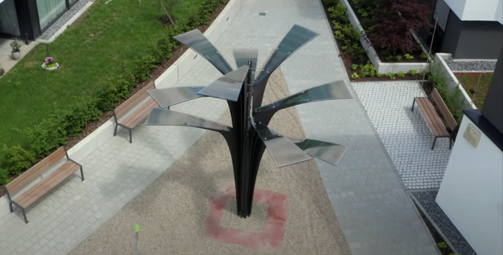 The solar tree stands on the ceiling slab of an underground parking garage, where the other system components, such as the inverter, are located.