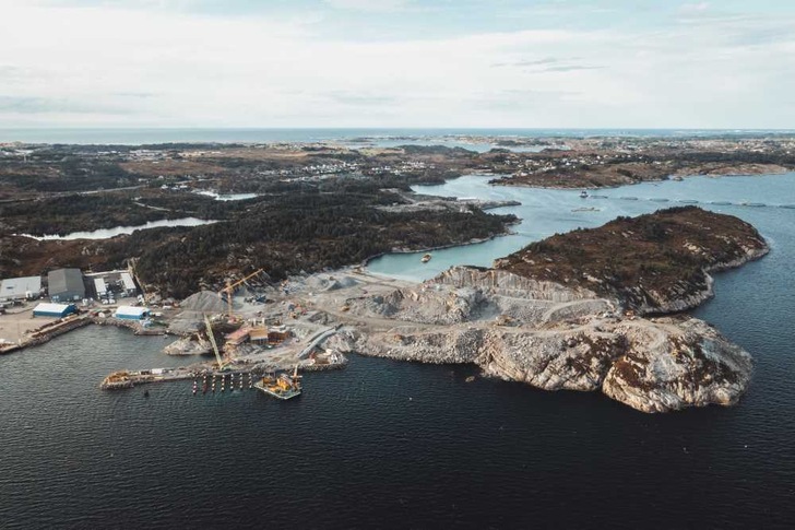 The island Ljøsøyna at the norwegian West coast from a bird's eye view, two hours by car from the port city of Bergen city of Bergen: 800,000 m3 of rock is being moved here. - © Northern Lights
