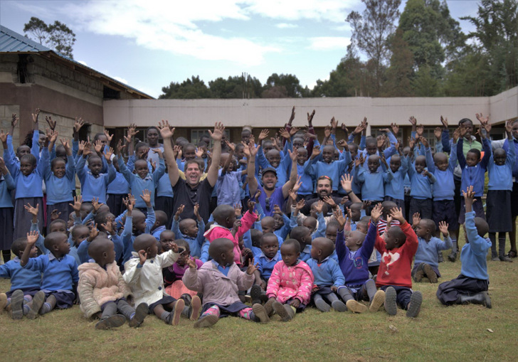 The TrinaTracker Project Development team celebrates with students of the Watergate Educational Centre.