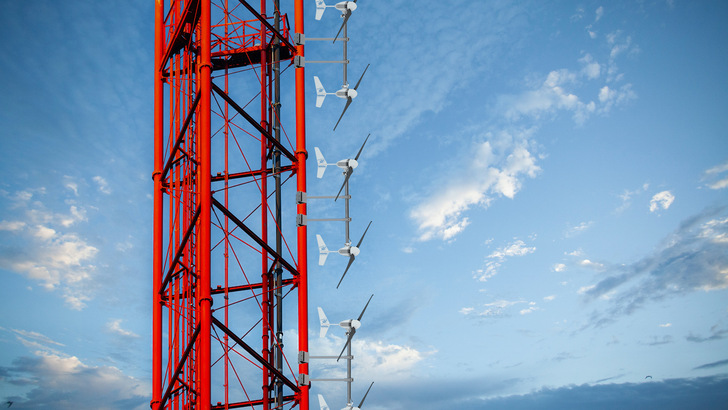 Small wind turbines on a radio mast.