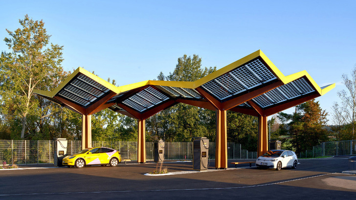 The Fastned stations stand out with curved their solar canopies.
