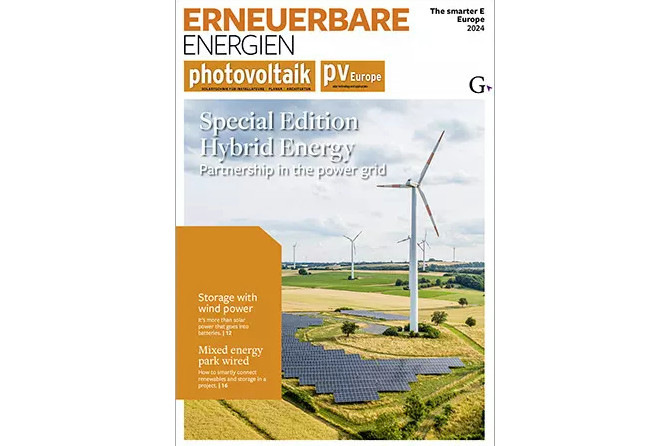 Wind turbines and solar panels in a field on a magazine cover titled "Erneuerbare Energien: Special Edition Hybrid Energy". - © TFV