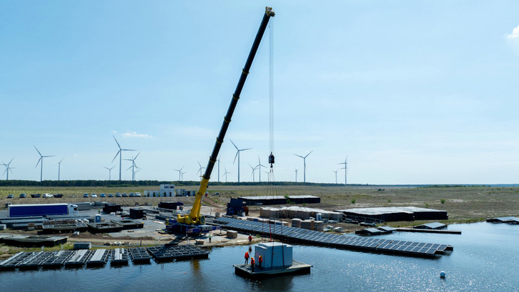 Launching the transformer stations for the floating solar park at Ostsee near Cottbus in East Germany