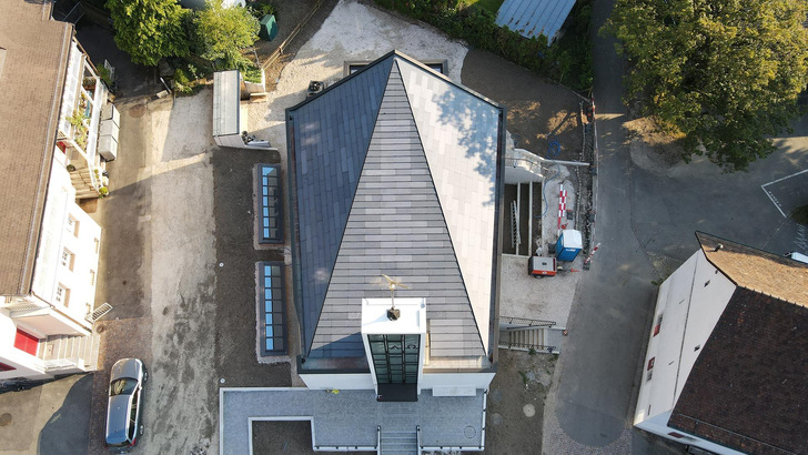 Harmoniously positioned adjustment plates for an even and visually consistent roof surface.