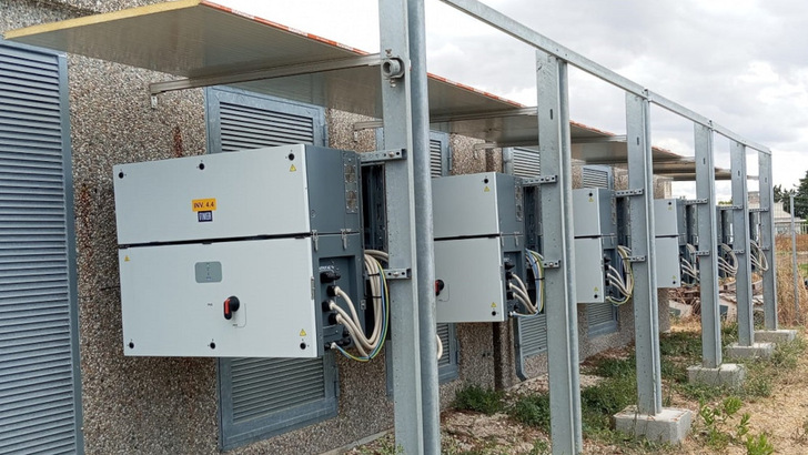 The string inverters are sheltered by a protective roof for added security