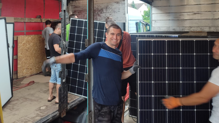 Unloading the solar panels from the truck in Ukraine.