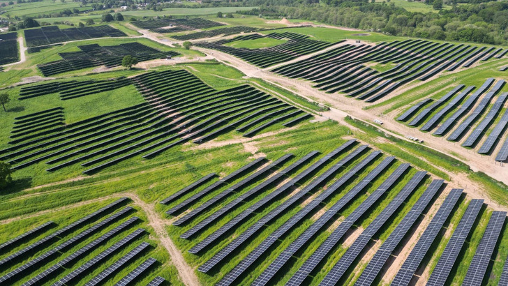 Panel rows ripple across European Energy's Marksbury solar park in the UK