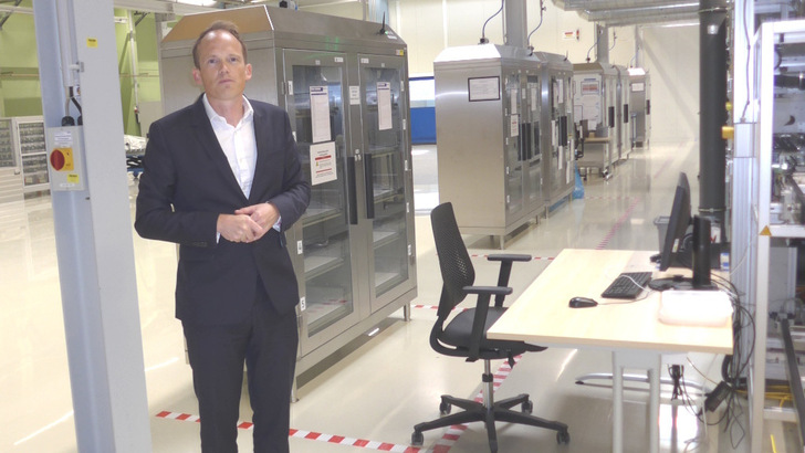 Ed Crossland, CTO, tours guests through Oxford PV's Brandenburg facility during the company's 10th anniversary celebrations