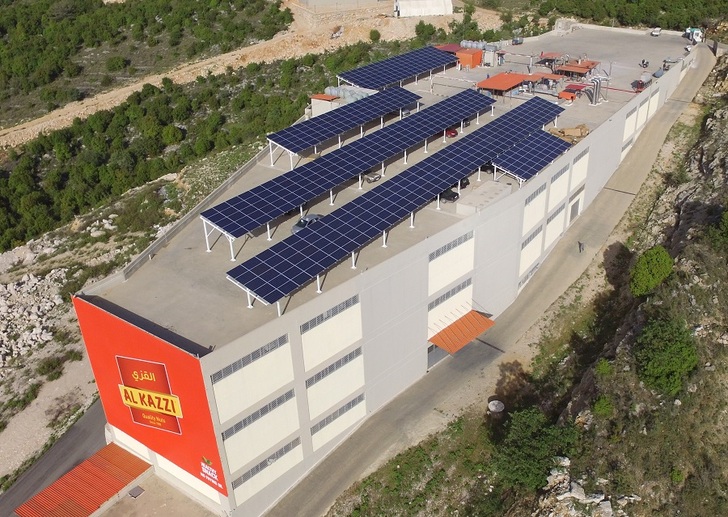 615 PV modules are mounted on a steel structure in the form of a car port on the roof of Al-Kazzi factory in Hsoun/Lebanon. - © IBC Solar
