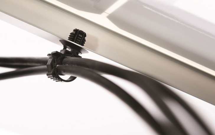 The Locking Clamp fully closes and locks over a cable bundle.