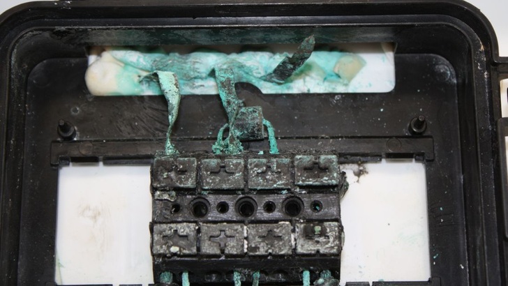 Melted contacts in the junction box of a solar module.
