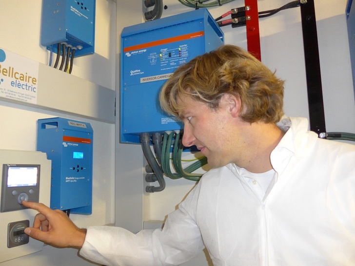 Matthijs Vader, Managing Director at Victron Energy checks the Color Control Display of the system.