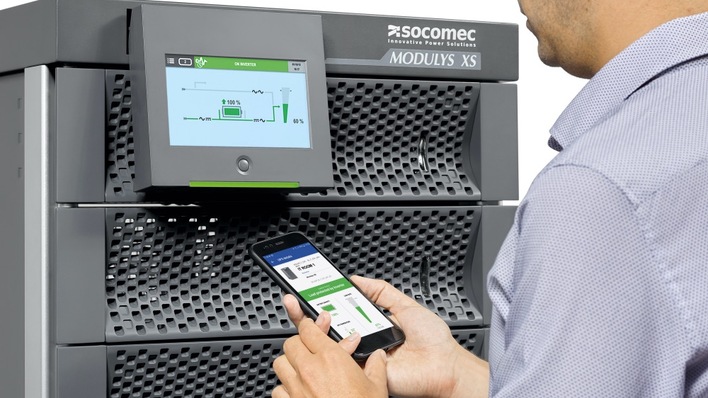 The cabinet is equipped with a retractable multilingual 7-inch touch screen display.