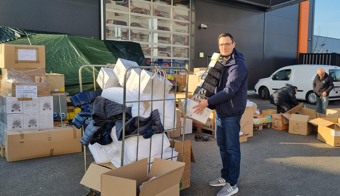 Schletter CEO Florian Roos helping out to get donations where they need to go.