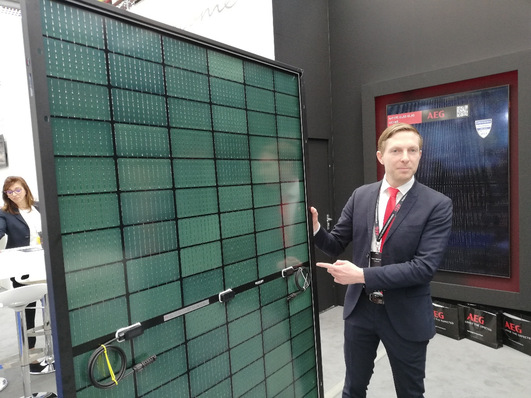  Conny Axel Hulverscheidt, CTO of Solar Solutions presents the new AEG BC Premium, 460 W glass-glass solar module  at Solar Solutions 2024 in Amsterdam.