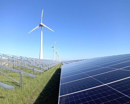 The Noordoostpolder solar facility in Flevoland/Netherlands is next to a wind park.