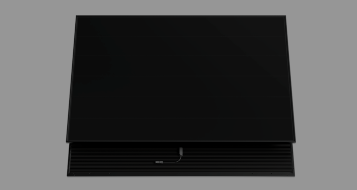 Black solar panel with connectors on a gray background. - © Aiko