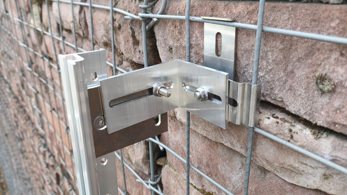 Rock steady: the clamp system holding a module to a gabion wall