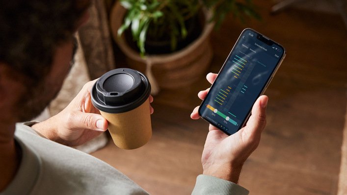 Checking the battery status and market earnings over a coffee break