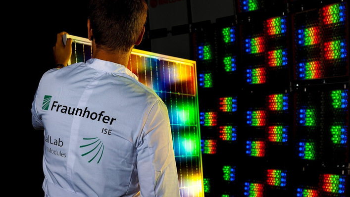 A CalLab researcher tests a solar module under a multispectral solar simulator