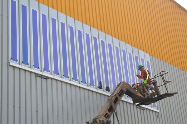 Installation of HeliaFilm on a Kandil Steel panel.