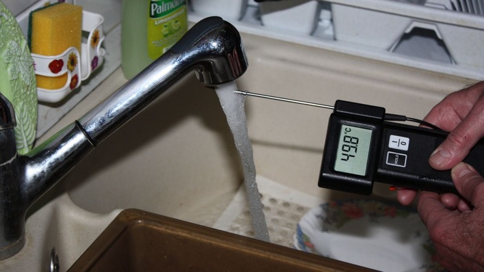 Around 44 degrees centigrade will do for kitchen sink.